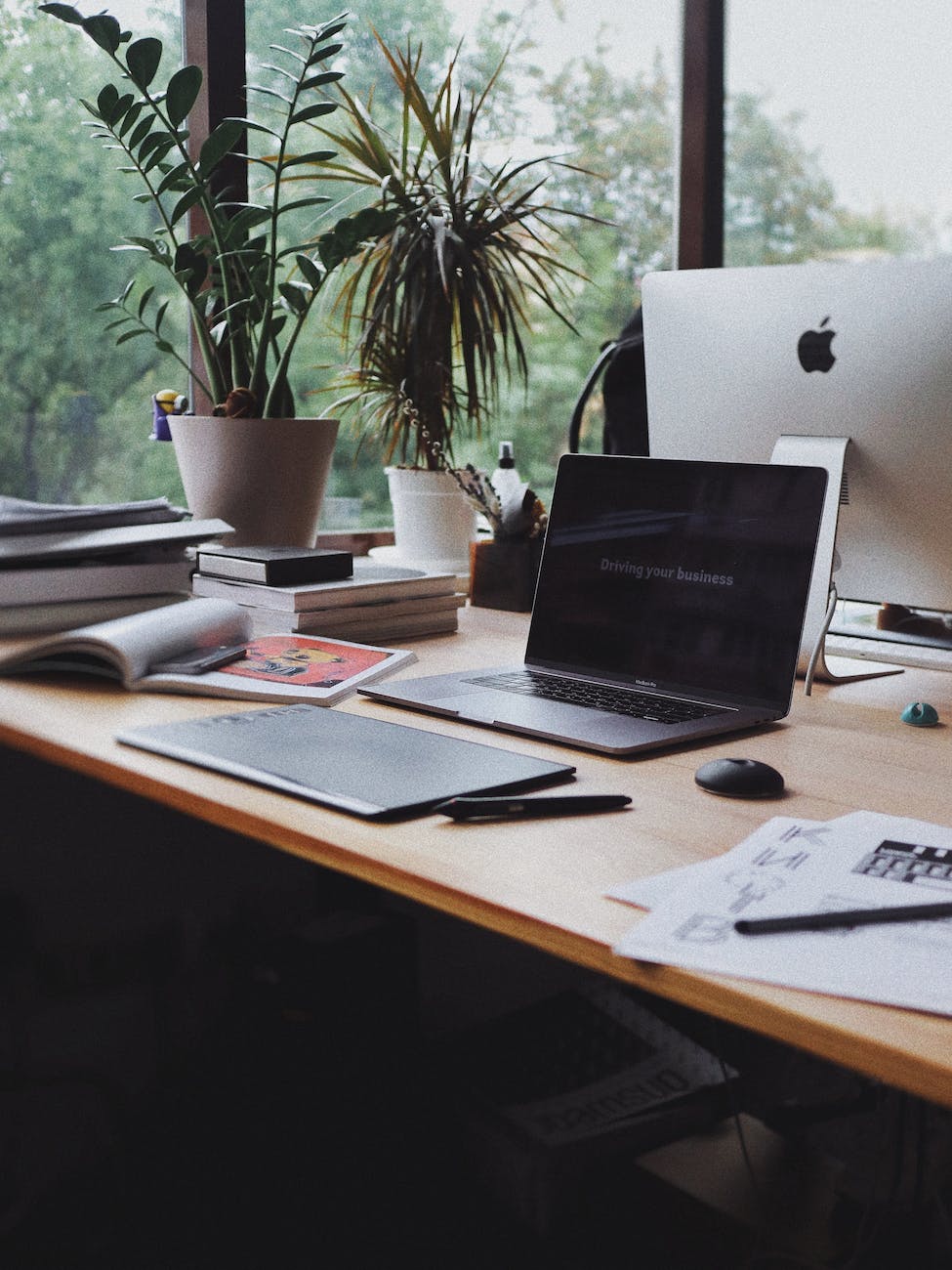 laptop on a brown office desk